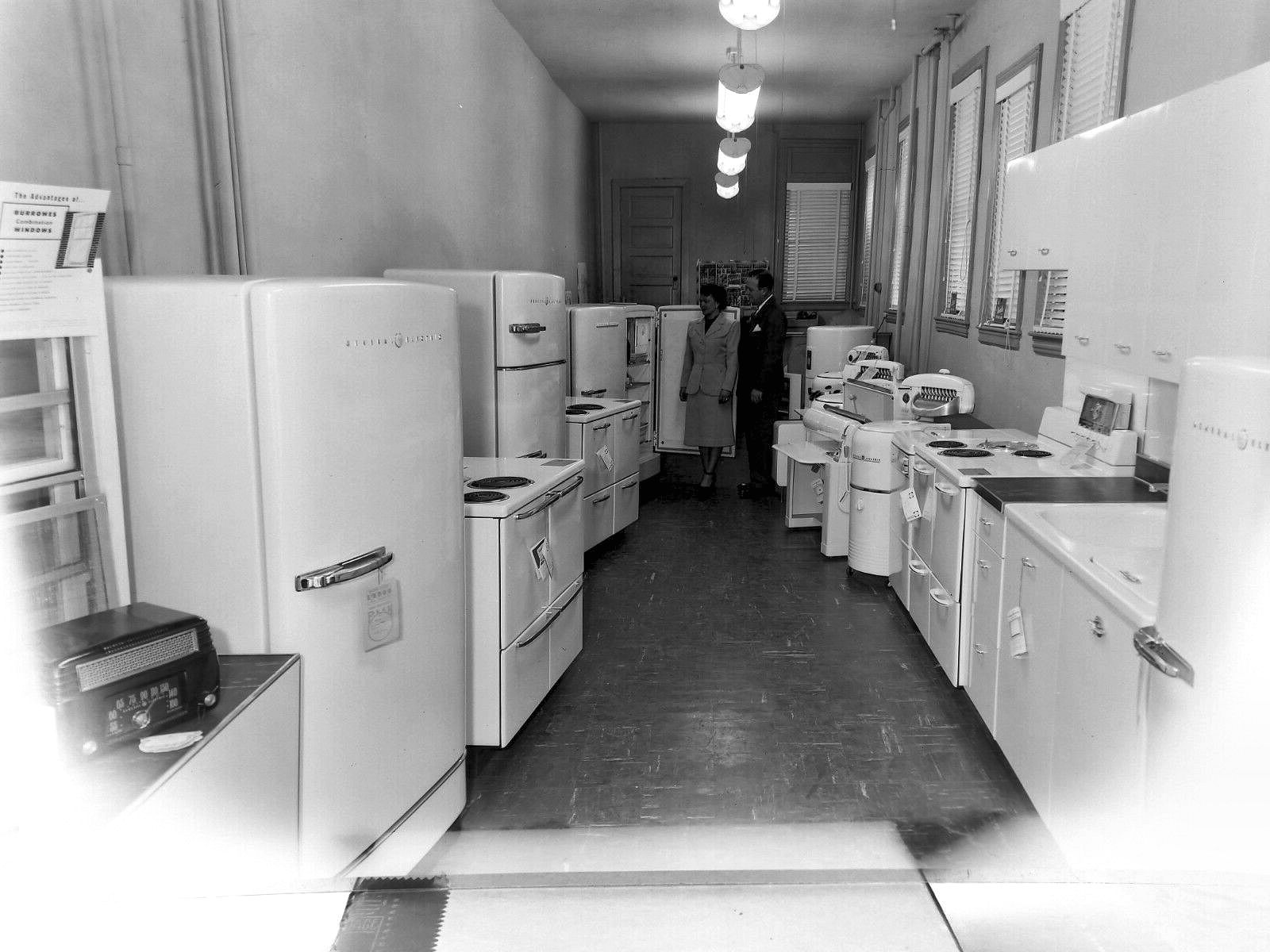 A General Electric appliance store window in 1954 full of machines sold as time savers